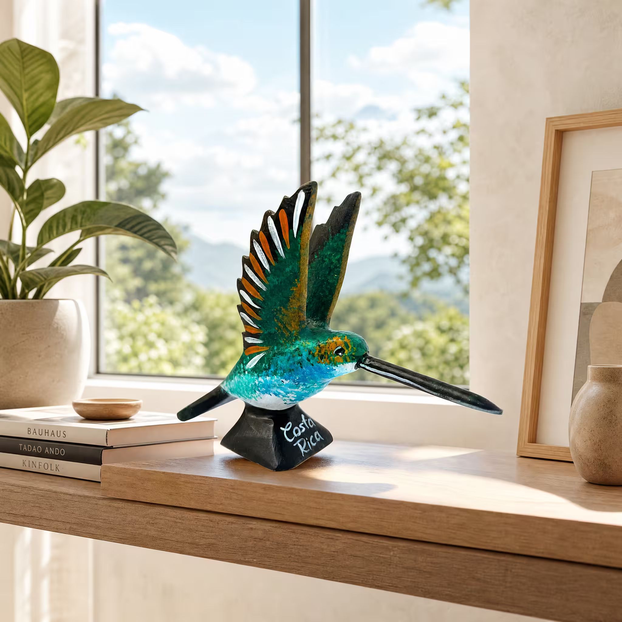 Multicoloured hummingbird, hand-painted reclaimed wood, handmade Costa Rica souvenir (styled in a room)